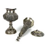 A Burmese silver embossed pedestal vase and a trumpet vase.