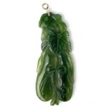 A Chinese fruit carved green hardstone pendant.