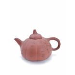 A Chinese Yixing pottery teapot, 19th century.
