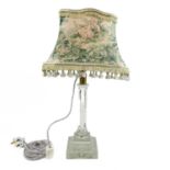 An Edwardian cut glass table lamp.