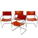 A set of four Bauhaus-style chrome and leather cantilever dining chairs.