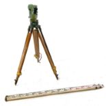 A Vickers Instruments Cooke V11 theodolite, with tripod and measure.