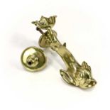 A Victorian brass dolphin door knocker.