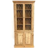 A pine display cabinet.