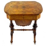 A Victorian walnut and inlaid work/writing table.