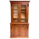 A Victorian mahogany two-part cabinet.