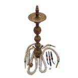 A tall pierced Indian brass hookah.