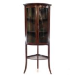 A late Victorian mahogany and inlaid bow front corner display cabinet.