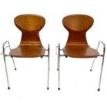 A pair of Tubax chrome and bentwood stackable chairs.