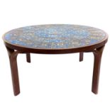 A Danish circular coffee table with Royal Copenhagen Fajance tiles.