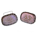 A pair of copper pin dishes, circa 1900, with repousse decoration of twin masted sailing ships.