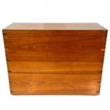 A large teak and camphor wood military type brass bound chest.