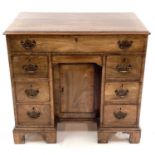 A George III mahogany kneehole gentleman's dressing table/writing desk.