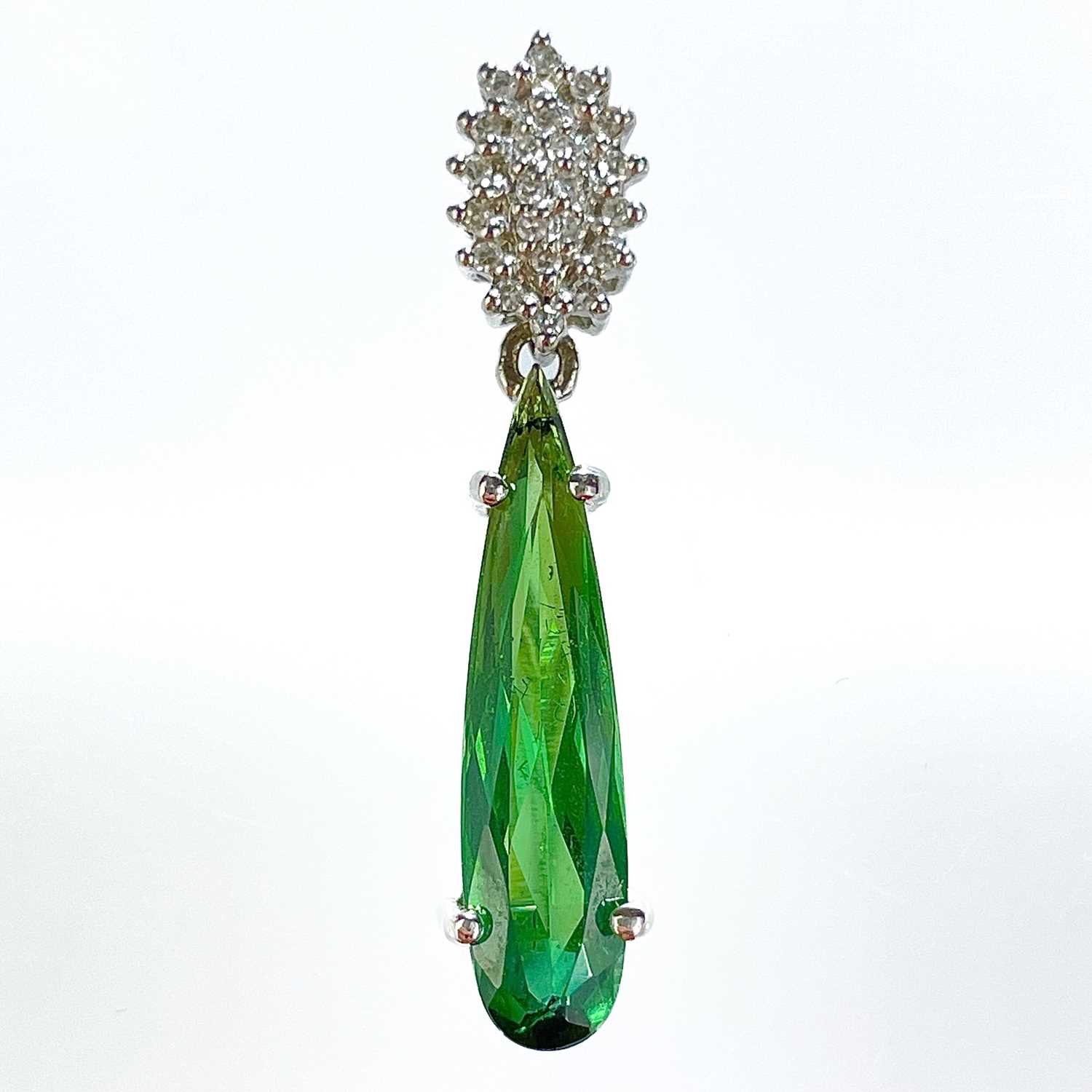 A stylish 18ct white gold Santa Rosa green tourmaline 18ct and diamond set pendant.