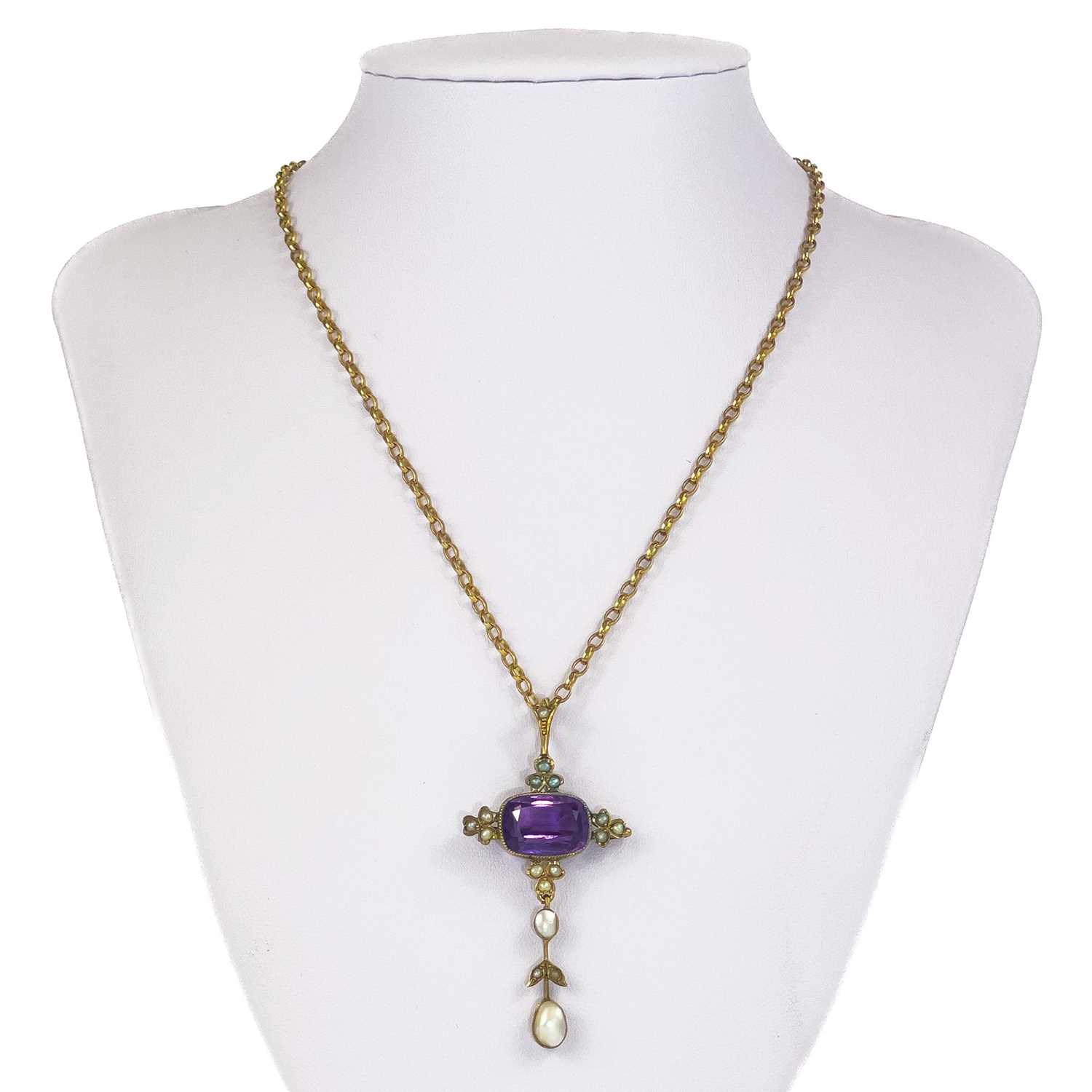 An Edwardian gold amethyst and pearl set pendant.