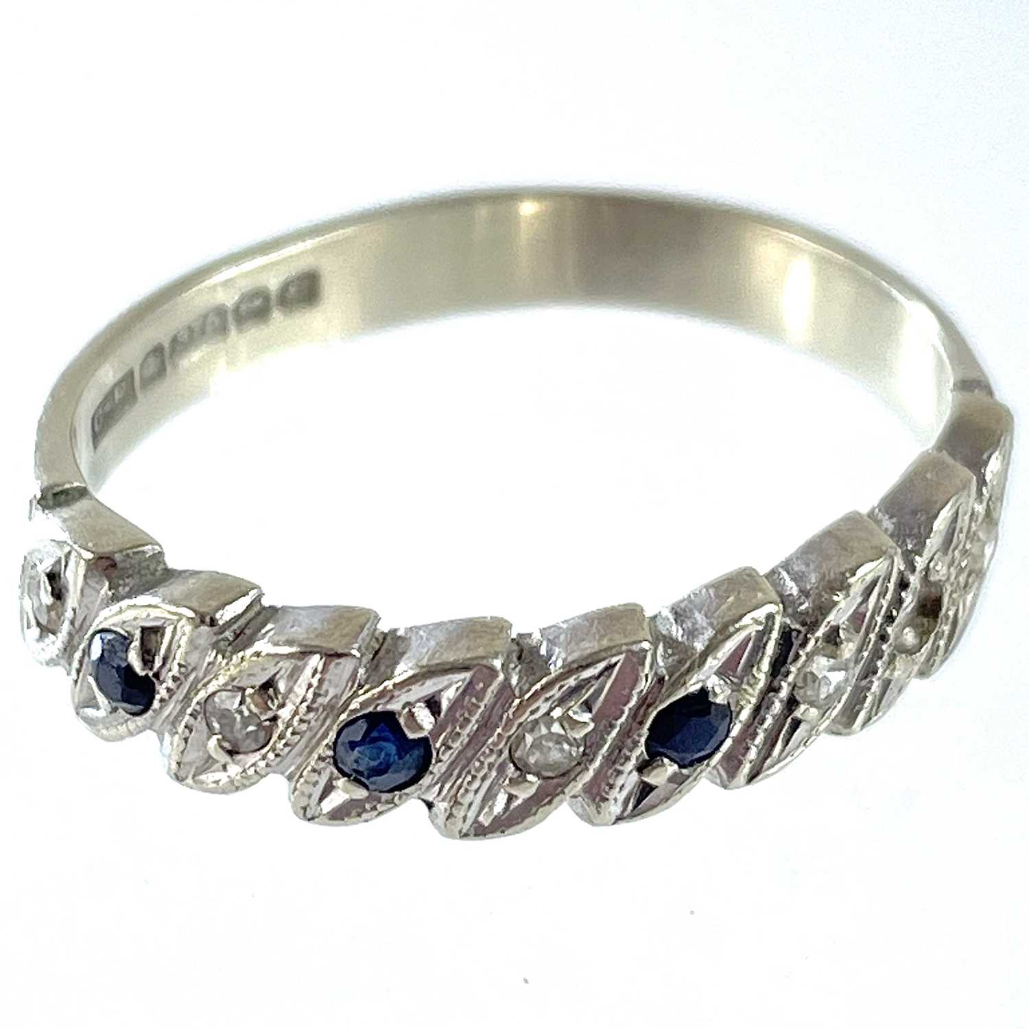 A 9ct white gold diamond and sapphire eight stone set half eternity ring. - Bild 4 aus 5