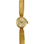 An Accurist 1960's 9ct gold ladies manual wind bracelet wristwatch.