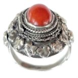 An 800 silver coral set locket ring.