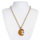A contemporary 9ct gold 'Man In The Moon' pendant necklace by Glenn Lehrer.
