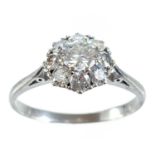 An early 20th century 18ct white gold diamond cluster ring.