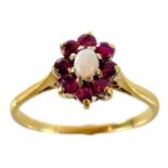 An 18ct gold opal and garnet cluster ring.