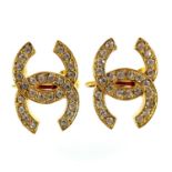 A pair of Chanel CC gold plated and crystal set clip earrings.