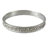 A contemporary silver bangle by Guy Royle.