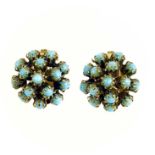 A Christian Dior 1960's pair of gilt metal and blue stone set clip earrings.