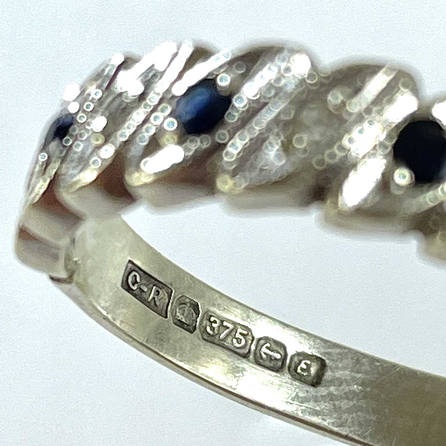 A 9ct white gold diamond and sapphire eight stone set half eternity ring. - Bild 3 aus 5