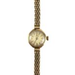 A 9ct Tissot ladies bracelet manual wind wristwatch.