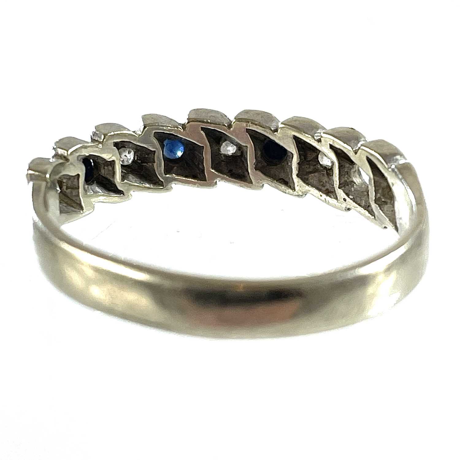 A 9ct white gold diamond and sapphire eight stone set half eternity ring. - Bild 5 aus 5