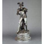 A 19th Century spelter figure of a standing warrior, raised on circular base 50cm h x 19cmArm to the