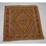 A brown and tan ground Mashwani Gazak rug with diamond design to the centre 120cm x 112cm