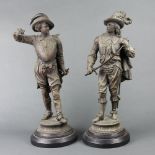 A pair of Victorian spelter figures of standing cavaliers, raised on socle bases 52cm h x 16cm w One