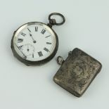 An Edwardian silver vesta with chased decoration, Chester 1907 together with a silver cased