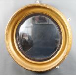 A 19th Century circular convex plate wall mirror contained in a gilt cushion shaped frame 56cm