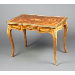 A French inlaid kingwood bureau plat with gilt metal mounts, fitted a drawer, raised on cabriole