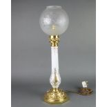 A gilt metal table lamp with opaque glass shade raised on an octagonal base 47cm x 19cm