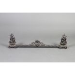 A 19th Century Continental pierced iron fender decorated birds and swags 28cm h x 101cm w x 9cm d