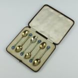 A set of silver and enamel coffee spoons with floral decoration Birmingham 1936, 46 grams, 9cm,