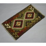 A green, brown and black ground Maimana Kilim rug with all over geometric design 195cm x 56cm