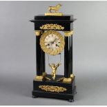 A 19th Century French Portico striking clock with silvered dial and Roman numerals, contained in