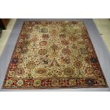 A Templeton Abbey cream and brown ground machine made Persian rug 311cm x 270cm Some signs of moth