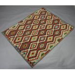 A yellow, orange and green ground Chobi Kilim with overall geometric design 195cm x 153cm