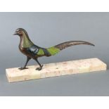 An Art Deco painted spelter figure of a walking pheasant raised on a rectangular marble base 23cm
