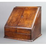 A Victorian wedge shaped oak stationery box with hinged lid, the base fitted a drawer 32cm h x
