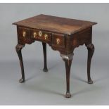 A 17th/18th Century oak lowboy fitted 1 long and 2 short drawers, raised on cabriole supports 74cm h