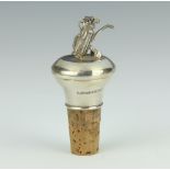 A silver mounted bottle stopper with a bag of golf clubs finial 8cm