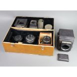 A Popular Pressman Camera, the lens marked 14 IN F/5.6 UU282547, a lens marked 2.9 4 5.6 8 11 16 22,
