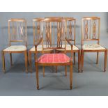 A set of 5 Edwardian inlaid mahogany stick and rail back dining chairs, raised on square tapered